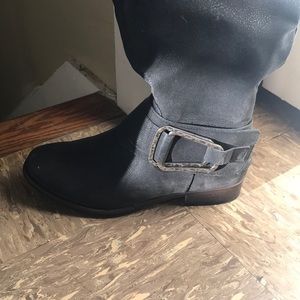 tall black buckled boots